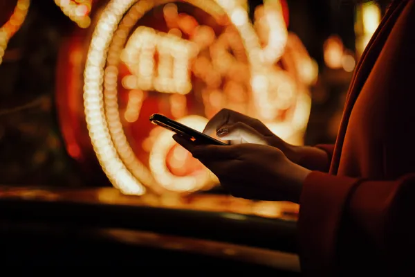 A person using their device against a moody casino-themed background, illustrating the smooth re-entry process at L85.